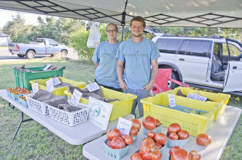 Nathan and Averyl Andrade of Healthy Futures Farm spend the mornings in the field before coming to the new farmers market. BY GEORGIA SPARLING